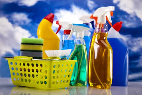 A cleaner working around office carpets in Camden after hours