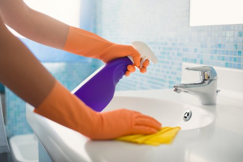 Professional carpet cleaning technician preparing equipment for a service appointment
